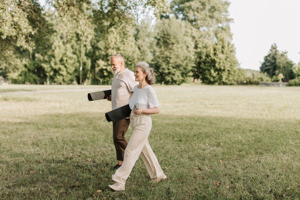 Active couple walking together outdoors enjoying life