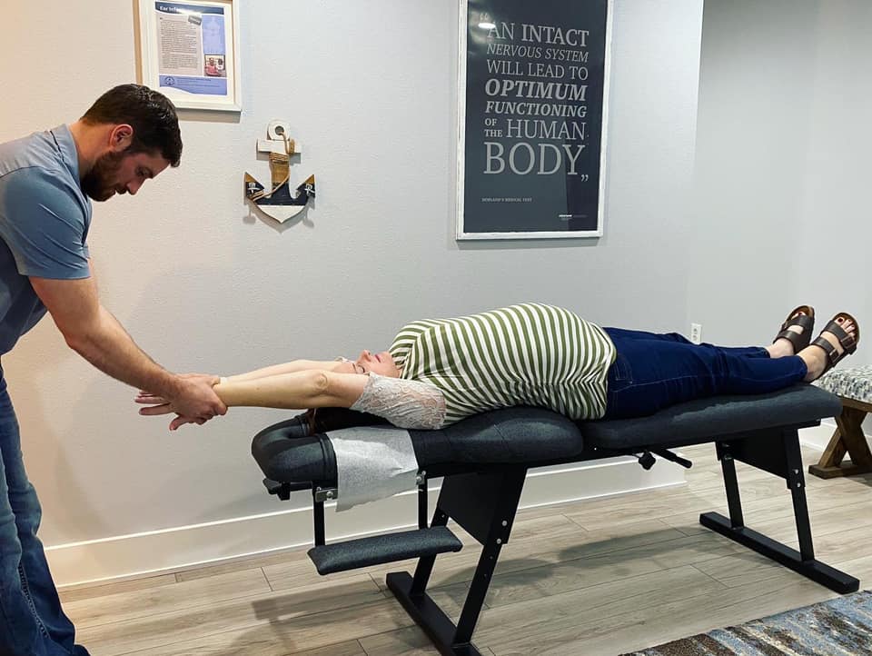 Doctor Gabriel Waterman providing adults with expert chiropractic care